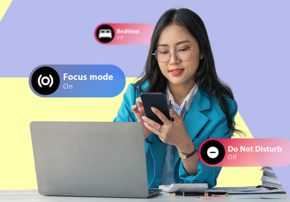 a-woman-at-a-desk-looking-at-her-phone-with-bedtime-focus-mode-and-do-not-disturb-ui-labels-displayed-around-her