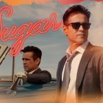 colin-farrell-in-a-suit-beside-a-vintage-convertible-in-sugar