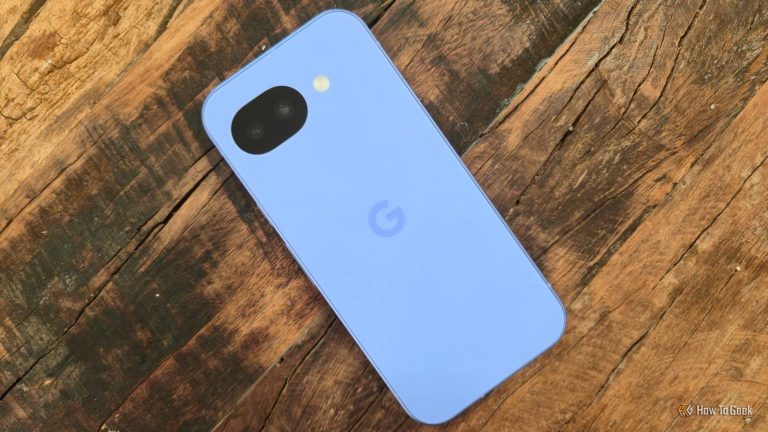 google-pixel-10a-lying-facedown-on-a-wooden-table