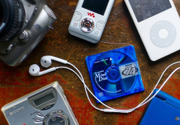 a-selection-of-nostalgic-retro-late-2000s-gadgets-including-an-ipod-minidisc-player-digital-slr-and-nintendo-ds