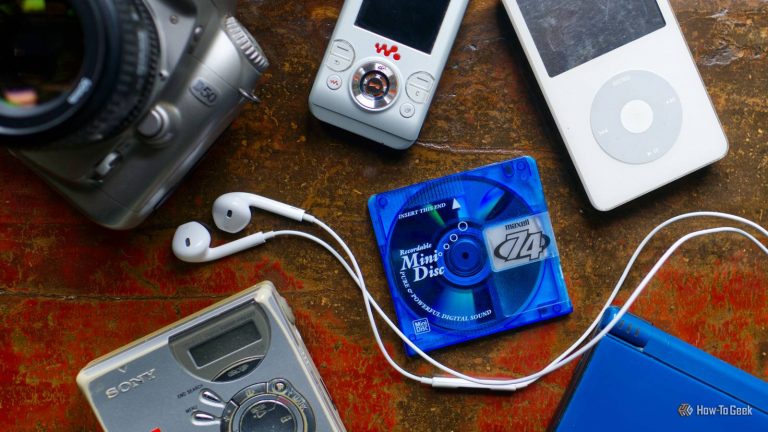 a-selection-of-nostalgic-retro-late-2000s-gadgets-including-an-ipod-minidisc-player-digital-slr-and-nintendo-ds