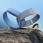 blue-and-gray-fitbit-air-bands-with-galaxy-rings-on-a-rocky-surface