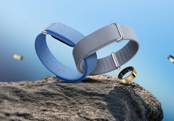 blue-and-gray-fitbit-air-bands-with-galaxy-rings-on-a-rocky-surface