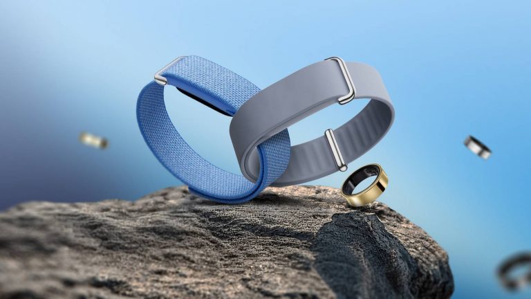 blue-and-gray-fitbit-air-bands-with-galaxy-rings-on-a-rocky-surface