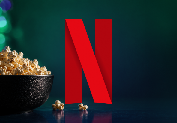netflix-n-logo-beside-a-bowl-of-popcorn-on-a-dark-background