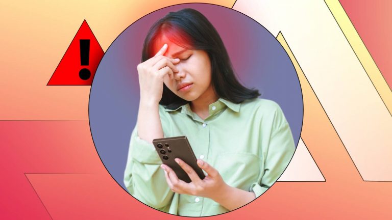 woman-holding-a-phone-with-a-headache